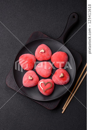 Delicious sweet mochi in the shape of red hearts 125411618