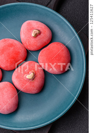 Delicious sweet mochi in the shape of red hearts 125411627