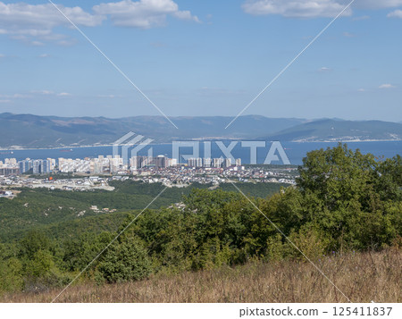 Black sea coast. bald mountain. Beautiful blue sea in Novorossiysk Black sea coast. bald mountain. Beautiful blue sea in Novorossiysk 125411837