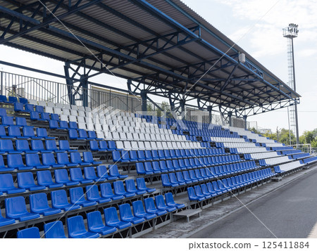 Armchairs seats blue chairs at the sport stadium Armchairs seats blue chairs at the sport stadium 125411884