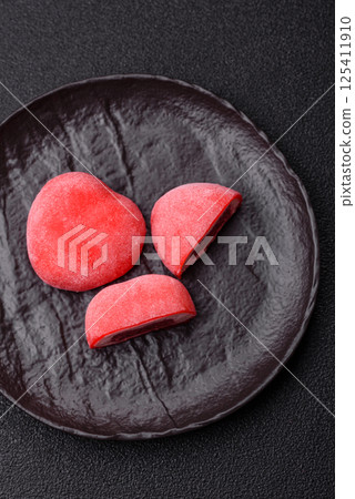 Delicious sweet mochi in the shape of red hearts 125411910