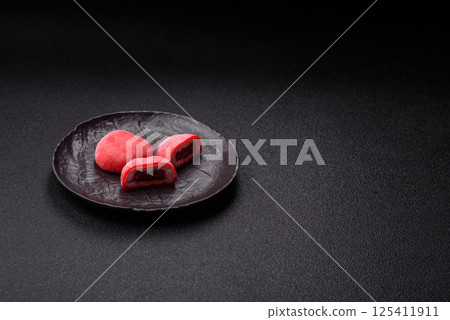 Delicious sweet mochi in the shape of red hearts 125411911