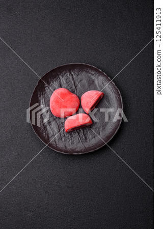 Delicious sweet mochi in the shape of red hearts Delicious sweet mochi in the shape of red hearts 125411913