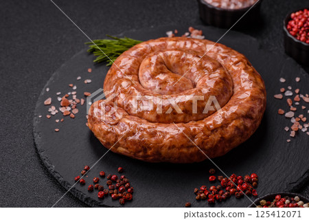 Delicious homemade sausage in the shape of a snail or spiral Delicious homemade sausage in the shape of a snail or spiral 125412071