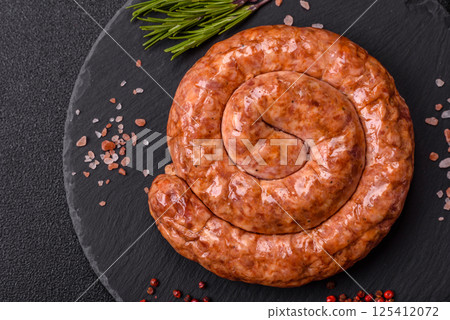 Delicious homemade sausage in the shape of a snail or spiral 125412072
