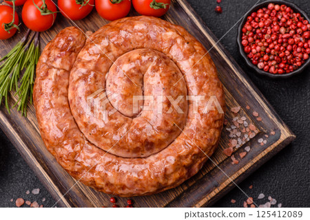 Delicious homemade sausage in the shape of a snail or spiral Delicious homemade sausage in the shape of a snail or spiral 125412089