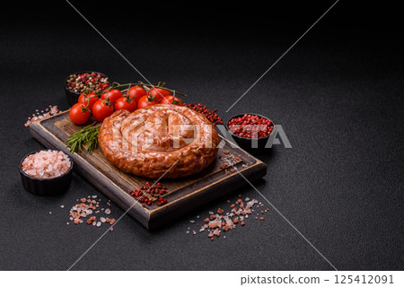 Delicious homemade sausage in the shape of a snail or spiral 125412091