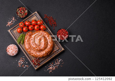 Delicious homemade sausage in the shape of a snail or spiral Delicious homemade sausage in the shape of a snail or spiral 125412092