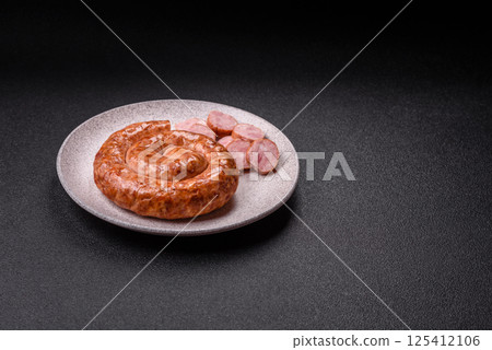 Delicious homemade sausage in the shape of a snail or spiral Delicious homemade sausage in the shape of a snail or spiral 125412106