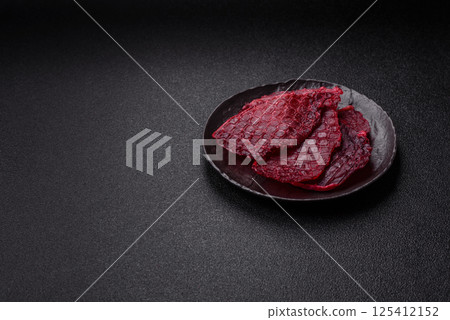 Dried beef slices, jerky, with cherry or plum flavor, salt and spices 125412152