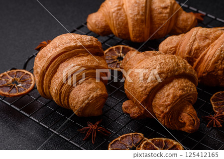 Sweet crispy croissants with chocolate filling Sweet crispy croissants with chocolate filling 125412165