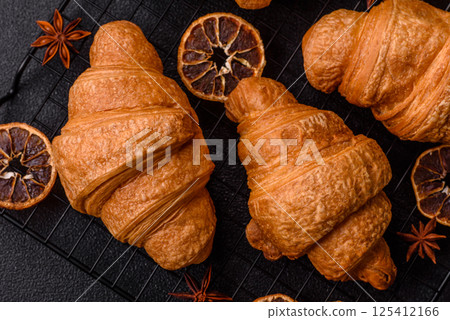 Sweet crispy croissants with chocolate filling Sweet crispy croissants with chocolate filling 125412166