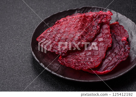 Dried beef slices, jerky, with cherry or plum flavor, salt and spices 125412192