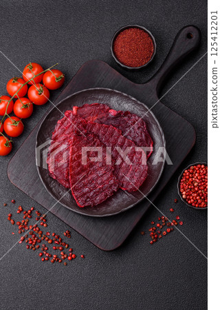 Dried beef slices, jerky, with cherry or plum flavor, salt and spices Dried beef slices, jerky, with cherry or plum flavor, salt and spices 125412201