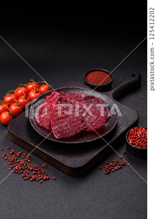 Dried beef slices, jerky, with cherry or plum flavor, salt and spices Dried beef slices, jerky, with cherry or plum flavor, salt and spices 125412202