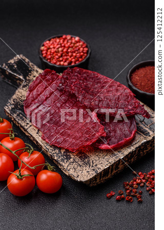 Dried beef slices, jerky, with cherry or plum flavor, salt and spices 125412212