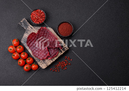 Dried beef slices, jerky, with cherry or plum flavor, salt and spices 125412214