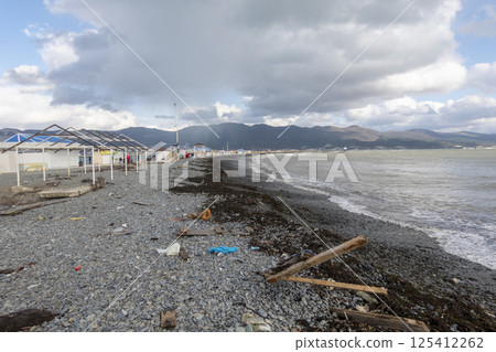 Novorossiysk, Russia 28 February 2025 Emerald Black Sea and rocky spit sun loungers and umbrellas Aleksino Novorossiysk, Russia 28 February 2025 Emerald Black Sea and rocky spit sun loungers and umbrellas Aleksino 125412262