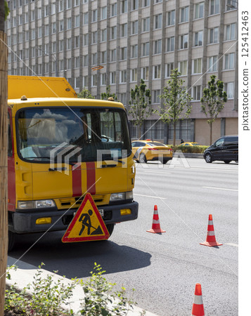 Moscow, Russia May 14, 2024: red yellow emergency truck on asphalt road Moscow, Russia May 14, 2024: red yellow emergency truck on asphalt road 125412463