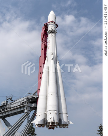 MOSCOW, RUSSIA - APRIL 23, 2024: Booster rocket Vostok at the pavilion Space on VDNCH. Walking Muscovites and tourists 125412487