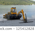 Abrau Durso, Russia 28 August 2024: Municipal aquatic weed harvesting equipment passes along lake Abrau-Durso 125412828