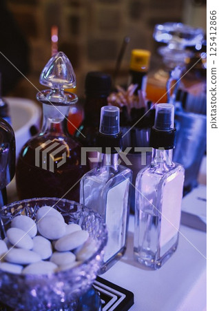 Assorted Bottles and Bowls on a Well-Stocked Bar 125412866