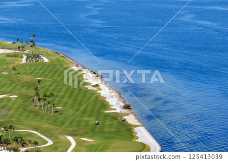 Large golf course and sports grounds with green grass in Boca Grande, small town on Gasparilla Island in southwest Florida Large golf course and sports grounds with green grass in Boca Grande, small town on Gasparilla Island in southwest Florida 125413039