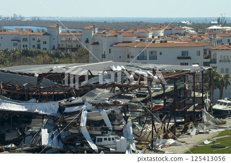 Hurricane Ian destroyed boat station in Florida coastal area. Natural disaster and its consequences Hurricane Ian destroyed boat station in Florida coastal area. Natural disaster and its consequences 125413056