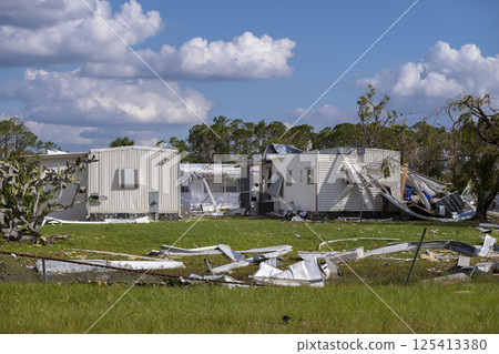 Florida Southwest region after hurricane season. Collapsed and damaged mobile homes in rural residential area. Consequences of severe natural disaster 125413380