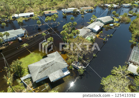 Flooded houses by hurricane Ian rainfall in Florida residential area. Consequences of natural disaster 125413392