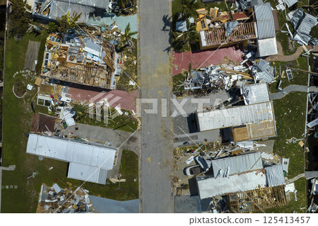 Destroyed by hurricane Ian suburban houses in Florida mobile home residential area. Consequences of natural disaster 125413457