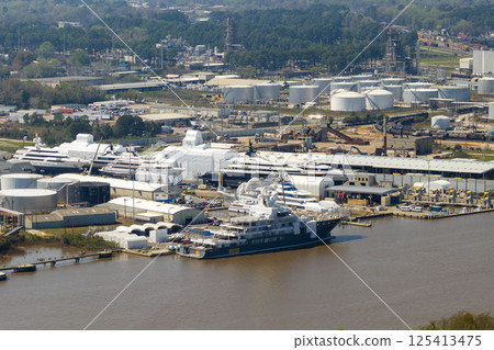 Construction of luxury yachts in shipyard in Savannah, Georgia. Assembly of sea ships 125413475