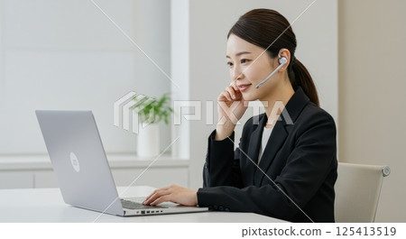 Japanese woman talking on a headset (AI generated image) 125413519