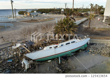 Capsized yachts left forsaken on shore after hurricane Milton on Manasota Key in Englewood, Florida Capsized yachts left forsaken on shore after hurricane Milton on Manasota Key in Englewood, Florida 125413654