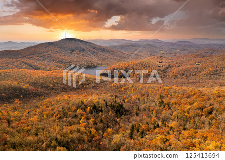 Autumn woods of Appalachian mountains at sunset with yellow and orange canopies in colorful forest. Landscape of wild nature in fall season 125413694