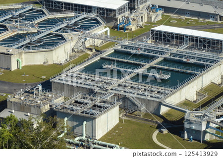 Aerial view of water treatment factory at city wastewater cleaning facility. Purification process of removing undesirable chemicals, suspended solids and gases from contaminated liquid 125413929