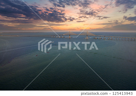 Aerial view of Sunshine Skyway Bridge over Tampa Bay in Florida with moving traffic. Concept of transportation infrastructure 125413943