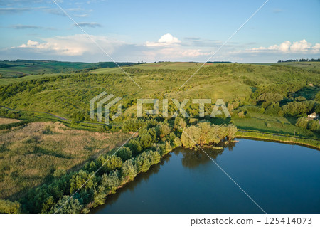 Aerial view of fish hetching pond with blue water in aquacultural area 125414073