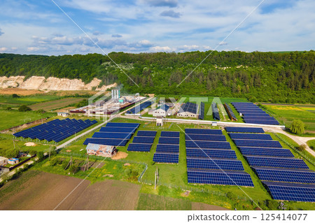 Aerial view of electrical power plant with rows of solar photovoltaic panels for producing clean ecological electric energy at industrial area. Renewable electricity with zero emission concept. 125414077
