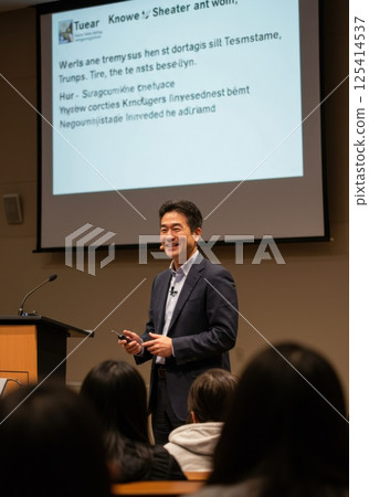 Japanese man giving a lecture using a speech device (AI generated image) Japanese man giving a lecture using a speech device (AI generated image) 125414537