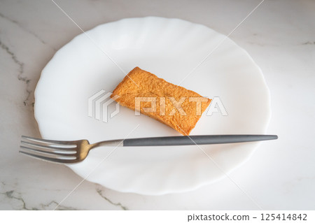 Simple composition of white plate and baked goods② 125414842