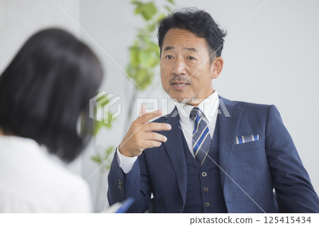 Businessman being interviewed Businessman being interviewed 125415434