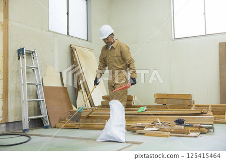 Workers working at a demolition site Workers working at a demolition site 125415464