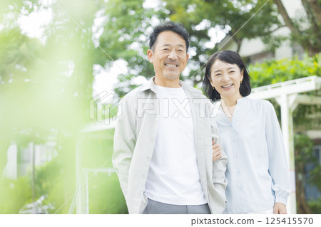Middle married couple cuddling with smile Middle married couple cuddling with smile 125415570