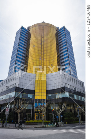 Shanghai, China - 1 April 2025: Modern Fangdi Building office tower at 201 Laoshan West Road, Pudong. Glass-and-steel high-rise with geometric architecture in Shanghai's bustling business district 125416469