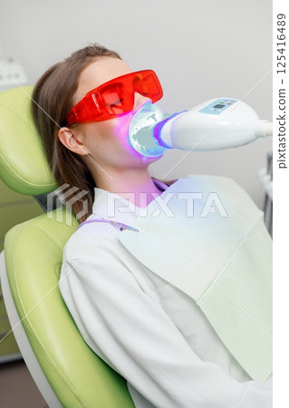 Doctor dentist, dentistry clinic, teeth whitening, dental health, dentist examining, whitening procedure dentistry professional 125416489
