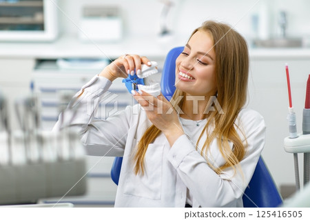 smiling dentist patient, healthy smile, visit dentist, dentist concept, dentistry clinic, beautiful woman smiling at the camera 125416505