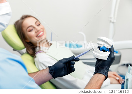 treating teeth, dental teeth model, dental tools, stomatological cabinet, dental check-up, dentistry professional, dental care treating teeth, dental teeth model, dental tools, stomatological cabinet, dental check-up, dentistry professional, dental care 125416513