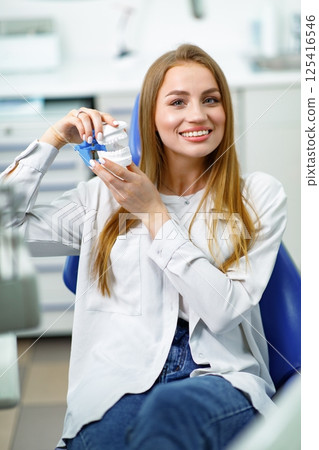 smiling dentist patient, healthy smile, visit dentist, dentist concept, dentistry clinic, beautiful woman smiling at the camera smiling dentist patient, healthy smile, visit dentist, dentist concept, dentistry clinic, beautiful woman smiling at the camera 125416546
