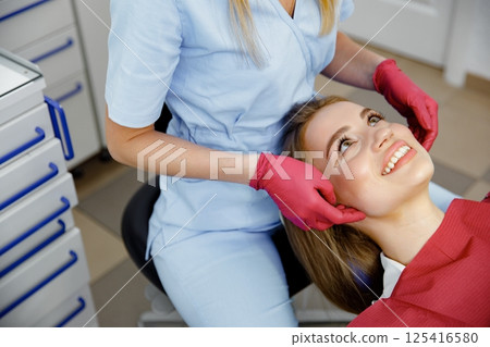 generous facial joints, osteopath performs, facial massage joints, checking teeth, oral care, healthy teeth, Dental treatment generous facial joints, osteopath performs, facial massage joints, checking teeth, oral care, healthy teeth, Dental treatment 125416580